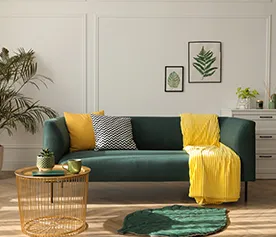 A green sofa set and a coffee table against white living room walls. 5 latest sofa set designs for the modern home blog.